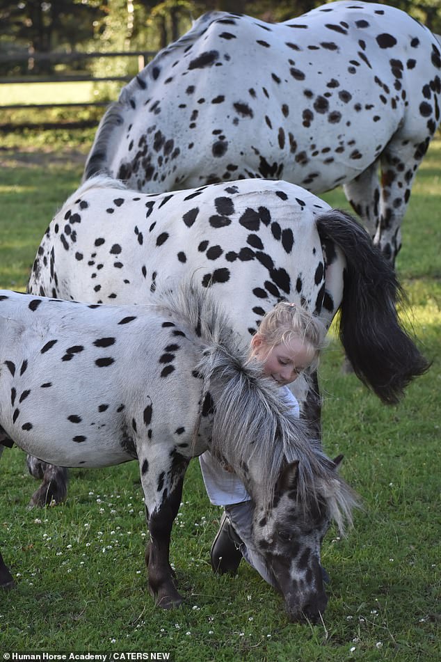 Daughter Jolie pictured stroking her Shetland pony, who was born at the same time as her